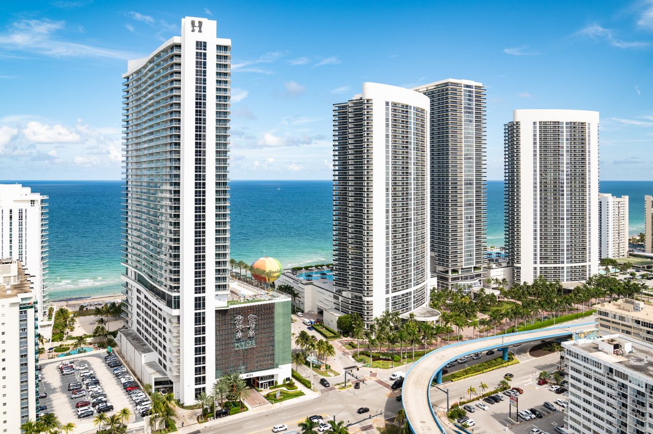Modern skyscrapers along Hollywood Beach, Florida's coastline with ocean view.